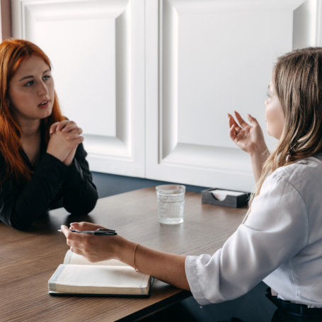 Mental health concept. Communication session of woman psychologist and client. Psychotherapy or talk therapy as help people with variety of mental illnesses and emotional difficulties